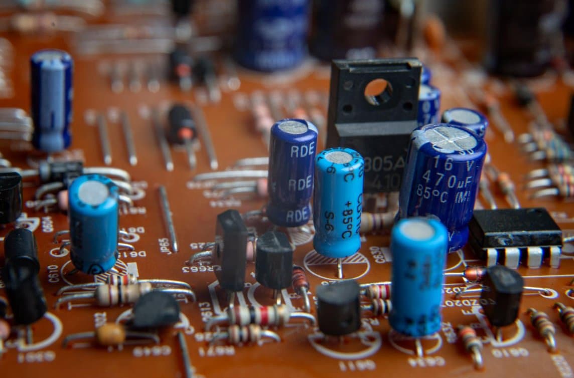 Close-up of a populated circuit board with capacitors and resistors