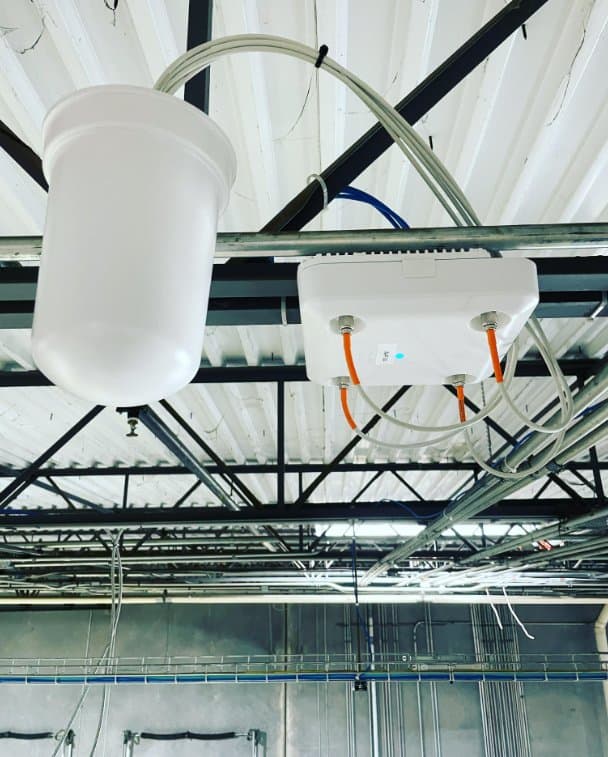 Enterprise wireless access point mounted on a facility ceiling